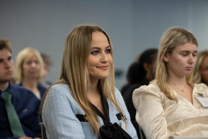 A student listens to the panel