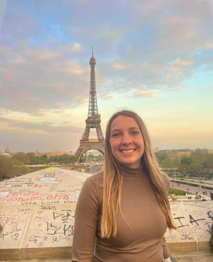 Allison Viney in front of the Eiffel Tower